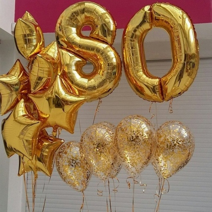 Композиция в золоте со звездами и шариками конфетти на 80 лет