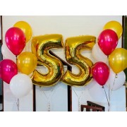 Композиция с красно-белыми и золотыми воздушными шарами на 55 лет женщине